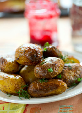 roasted new potatoes on white plate