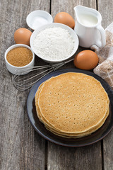 crepes and ingredients for their preparation, vertical, top view