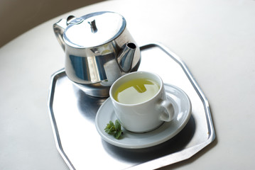 teapot and a cup on a tray