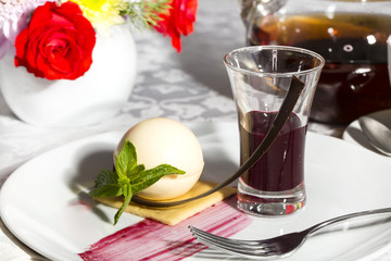 dessert, a piece of cake on the table with a cup of tea