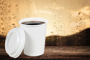 Cup. Opened take-out coffee with cup holder. Isolated on a white