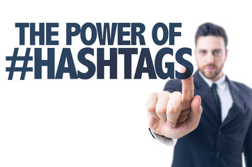 Business man pointing the text: The Power of Hashtags