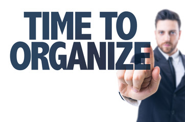 Business man pointing the text: Time to Organize