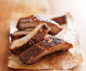 pile of barbecue spare ribs on cutting board