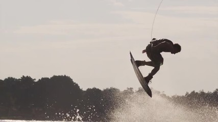 USA, Florida, Orlando, Maitland Lake. Young man on wakeboard