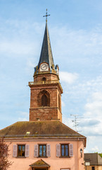 Fototapeta na wymiar Belfry of a church in Bergheim - France