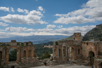 Fototapeta na wymiar Ruins of the ancient greek theater of Taormina, Sicily the Etna