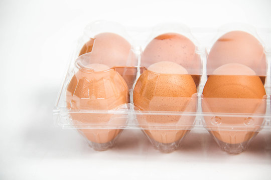 carton of fresh free range eggs on a white background.