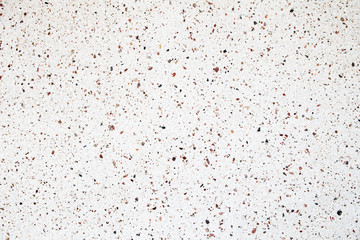 Fototapeta na wymiar pebbles on a white wall, background