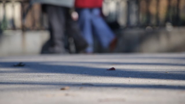 Defocused Feet Of People Walking, Close Up