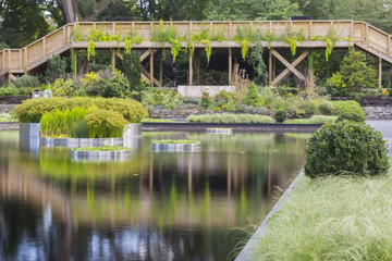 Fototapeta na wymiar Wooden bridge with reflections on the water