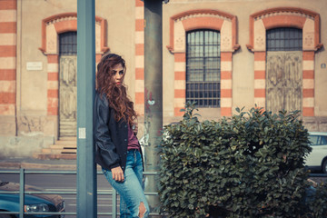 Beautiful girl posing in an urban context