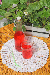 drink in a glass on a table in the garden