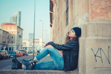 Beautiful girl posing in an urban context