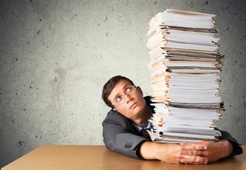 Stack. Office worker holding paperwork stack