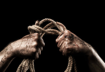 Fototapeta na wymiar Male hand with rope. Conception aggression