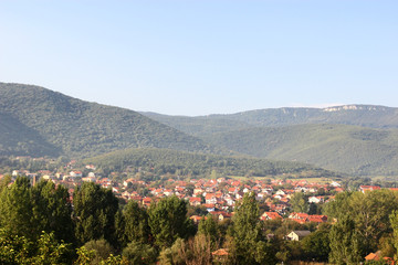 Fototapeta na wymiar Town in the mountain valley