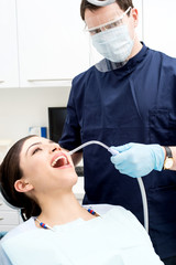 Dentist examine on a female patient