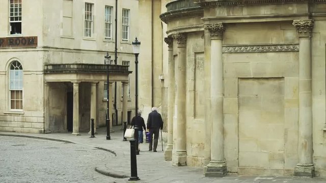WS Senior couple walking down street / Bath,Somerset, UK