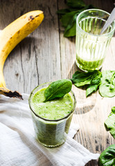 fresh, green smoothie with spinach, banana in a glass, healthy b
