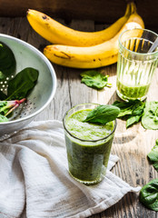 fresh, green smoothie with spinach, banana in a glass, healthy b