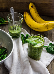 green smoothie with spinach leaves, banana with peanut milk in a