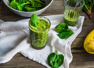 green smoothie with spinach leaves, banana with peanut milk in a
