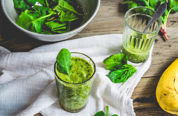 green smoothie with spinach leaves, banana with peanut milk in a