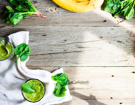 Vitamin green smoothie with spinach leaves, banana and peanut mi