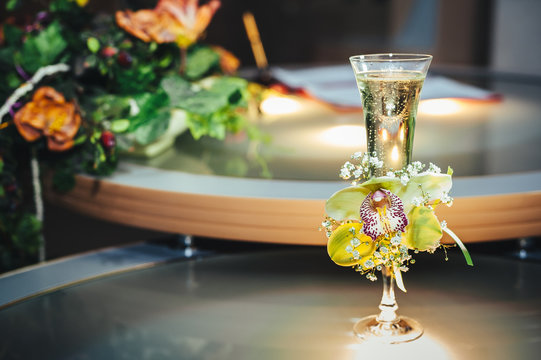 Wedding Bouquet And Champagne Glass With Flowers