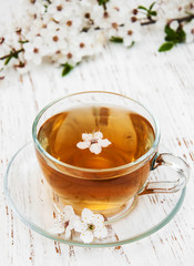Cup of tea and spring blossom