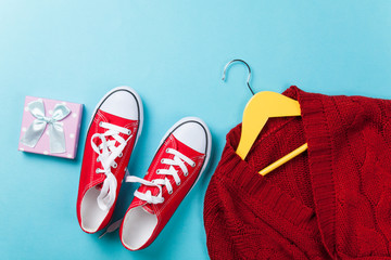 gumshoes and hanger with sweater and gift