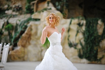 Fototapeta na wymiar Young beautiful blonde model bride