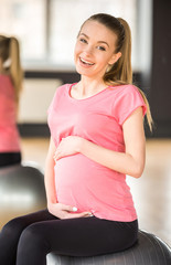 Fototapeta na wymiar Pregnant woman. Fitness.