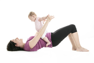 Fototapeta na wymiar mother and baby gymnastics yoga