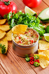 Guacamole with avocado, lime, tomato, and cilantro