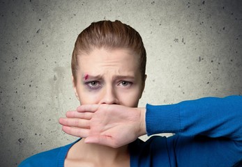 Fake. Young girl crying with her hand covering her mouth