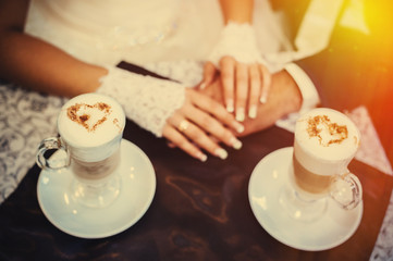 Love you honey.  Newly wed couple drinking cappuccino in cafe.