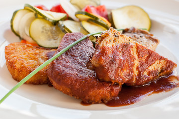 Meat with sauce and vegetables