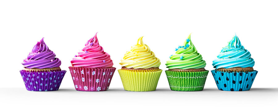 Colorful cupcakes on white