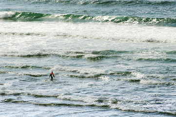 surfer towards the sea in Sabon  beach Corunna Spain