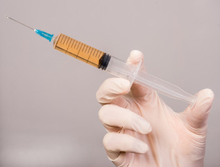 Hand with syringe