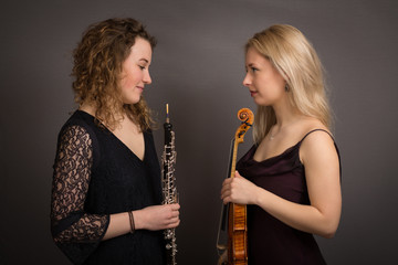 Shy Female Musicians Formally Dressed