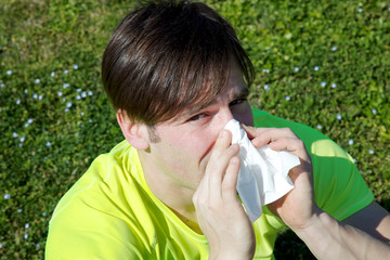 Man suffering allergy sneezing in spring
