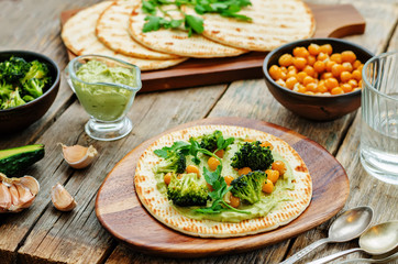 vegan tortilla with roasted broccoli and chickpeas and avocado s