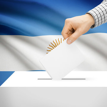 Ballot box with national flag on background - Argentina
