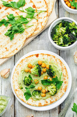 vegan tortilla with roasted broccoli and chickpeas and avocado s