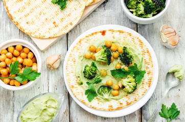 vegan tortilla with roasted broccoli and chickpeas and avocado s