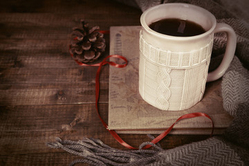 Cup of tea with book on table close-up