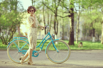 Obraz premium cheerful girl on a bicycle movement